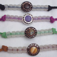SHOWN: Sun in black, lavender, green and bronze